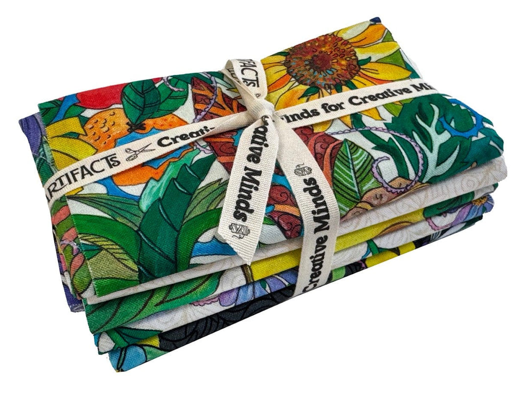 Stacked floral fabric bundles tied with ribbon