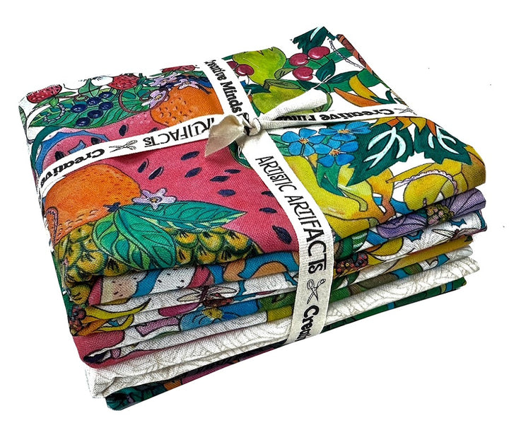 Stack of colorful fabric with fruit patterns.