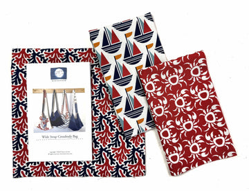 Fabric with nautical and crab patterns.