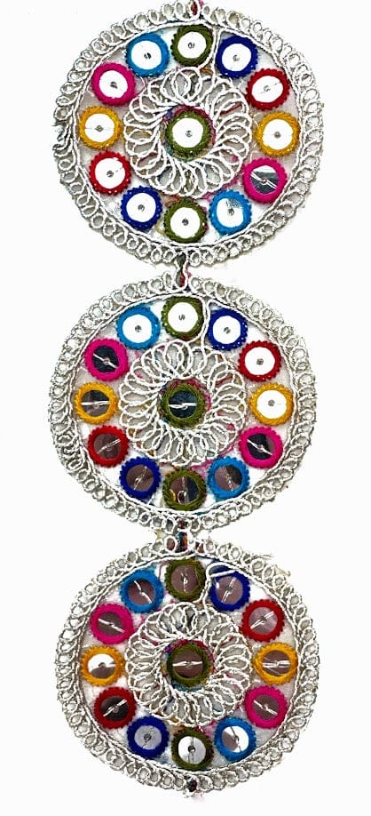 Three connected, colorful, circular ornaments.