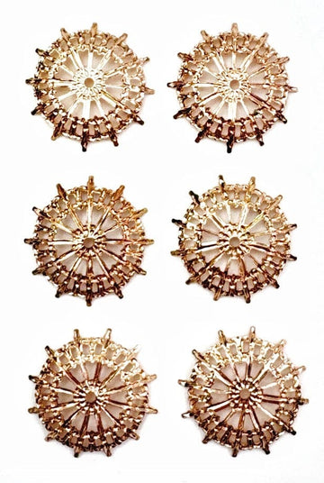 Six gold, starburst-shaped decorative elements.