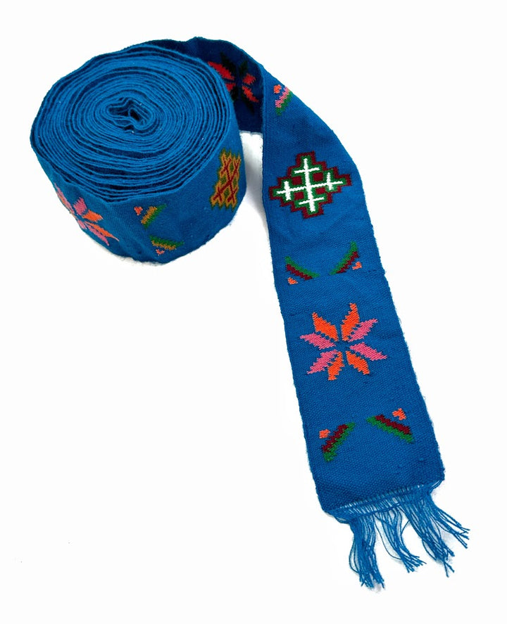 Blue embroidered fabric roll and sash.