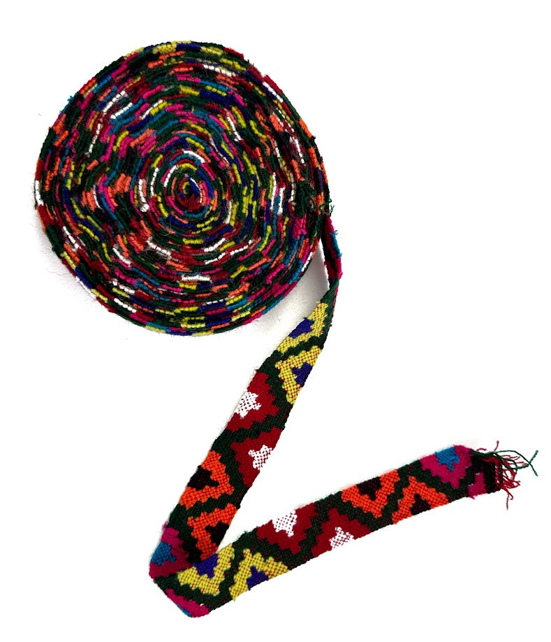 Coiled, colorful woven strap.