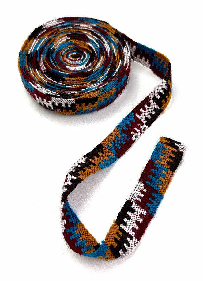 Rolled colorful woven ribbon.