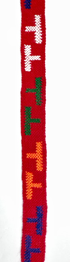 Red woven band with colorful T-shaped designs.