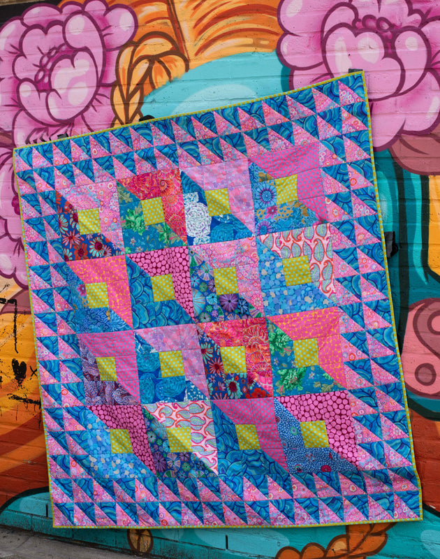 Pink boxes quilt on floral mural