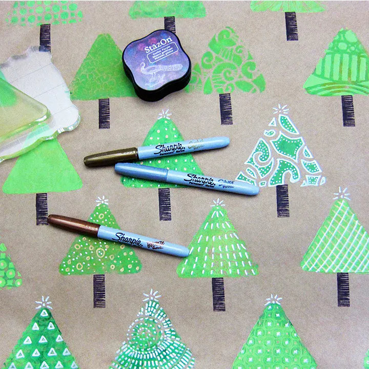 Christmas tree wrapping paper with markers and ink pad