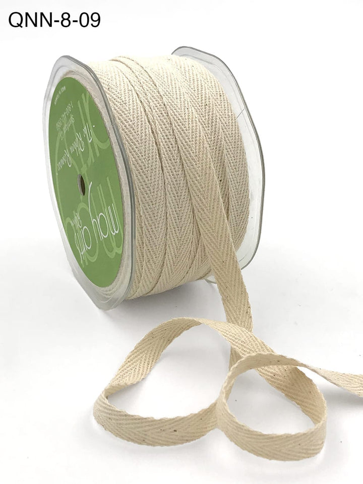 Beige herringbone ribbon on spool