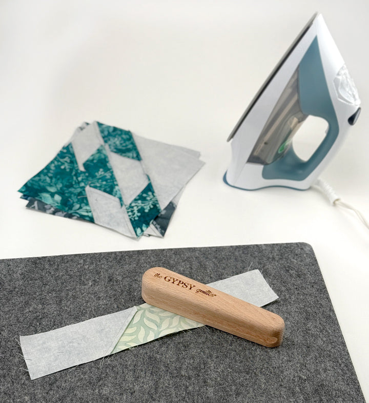 Quilting fabrics, iron, and pressing tool